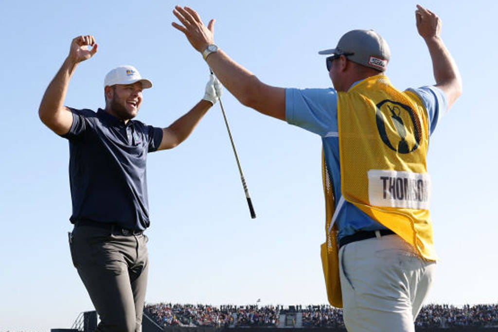Jonathan Thomson (left) celebrates after hitting a hole-in-one at The 149th Open at Royal St George's.
